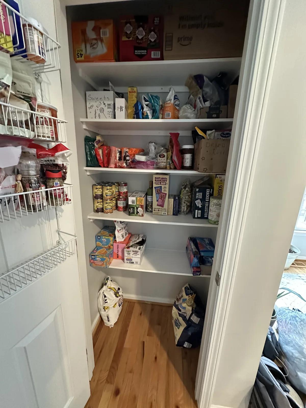 After: pantry shelves organized into clear, labeled zones